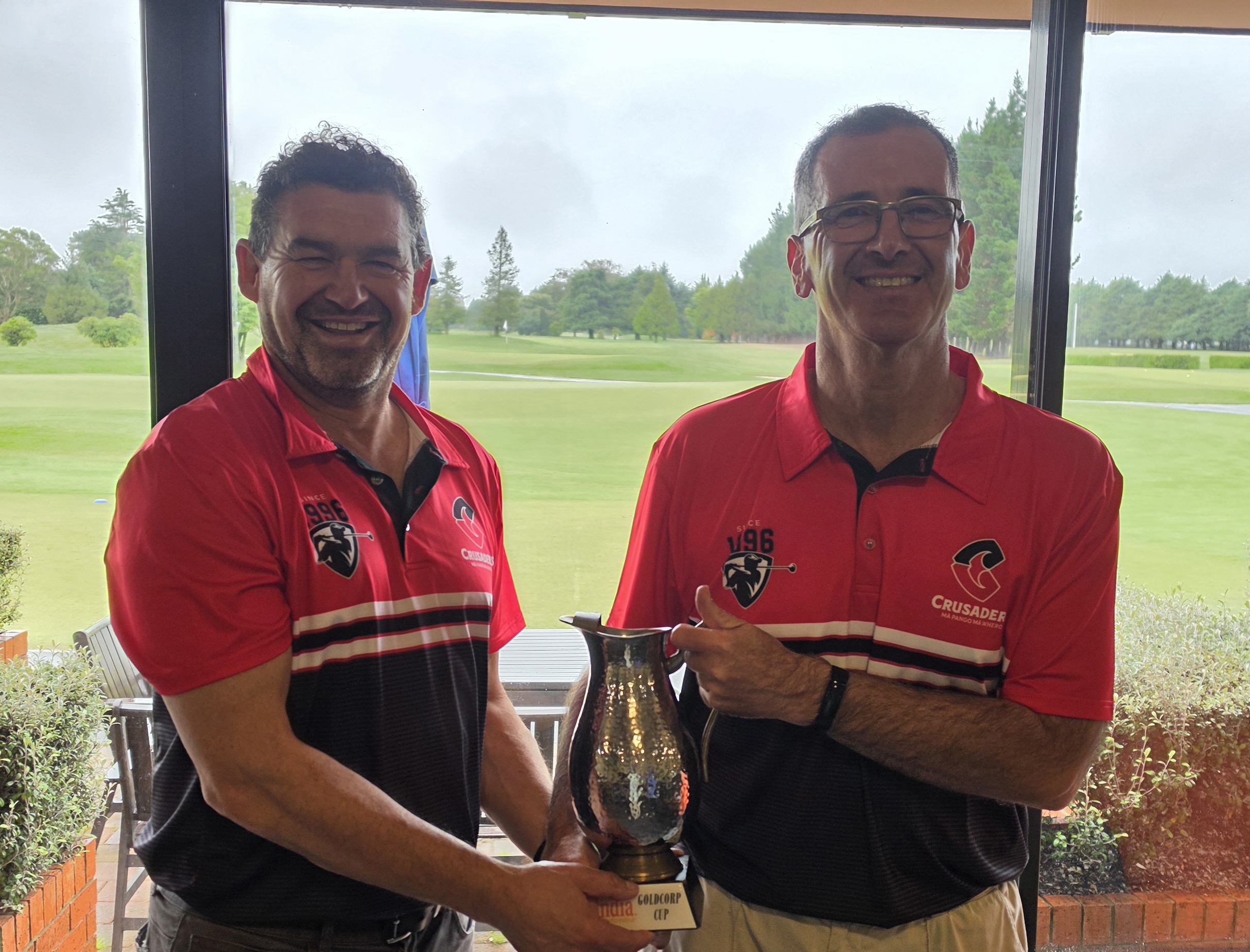 Tom and Dave H holding the Gold Corp Cup trophy