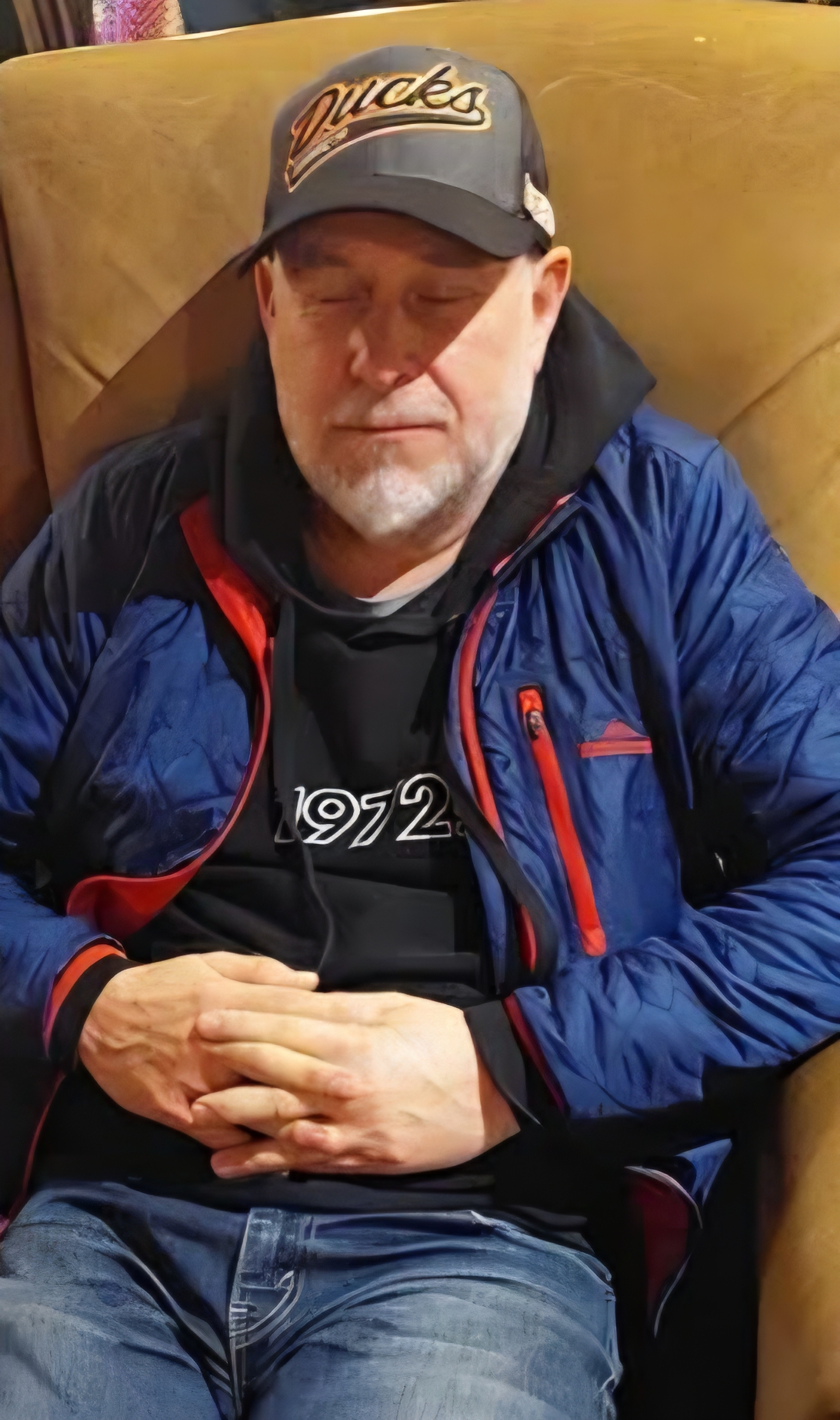 Glenn asleep in a chair